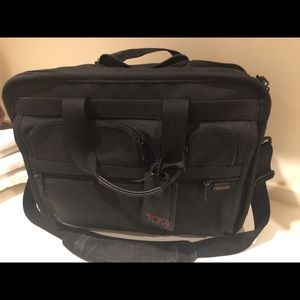 3 TUMI bags.  2 carry on and 1 suit bag. Black.